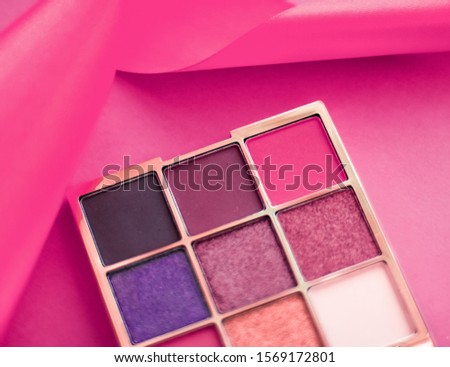Cosmetic branding, mua and girly concept - Eyeshadow palette and make-up brush on pink background, eye shadows cosmetics product as luxury beauty brand promotion and holiday fashion blog design