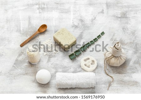 Spa-still life of skin care items on a light background. Natural scrub and soap with items to cleanse the skin. The concept of health and body care .