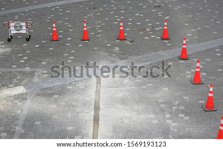 Empty parking lot with orange cones area. View from above.
