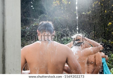 Refugees and migrants taking shower with cold water in November in cam Vucjak, Bihac, Bosnia and Herzegovina. Balkan route.  Thousands of migrants are trapped and they living in terrible condition. 