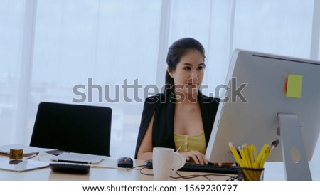 Businesswoman using desktop computer in office. Business concept.