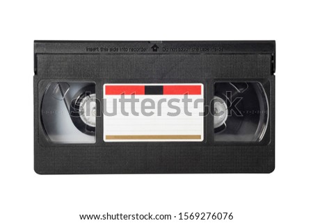 VHS video tape isolated on white background. Close-up Royalty-Free Stock Photo #1569276076