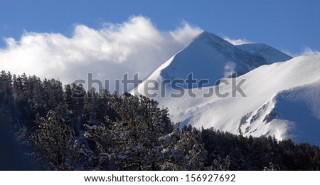 Panorama of winter mountains. Alpine ski resort Bansko, Bulgaria