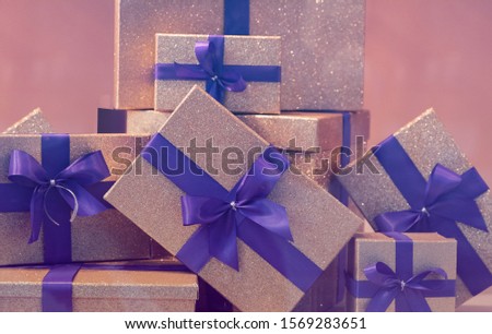 Gift box or packs on each other with fuchsia stripes