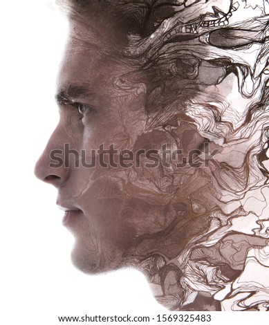 Paintography. Double exposure profile portrait of a man with strong features combined with handmade painting of wavy lines which dissolve into his skin