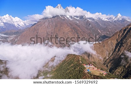 Epic aerial view of a mountain valley with Tengboche Buddhist Monastery in Himalaya mountains; trek to Everest base camp, Khumbu gorge, Solukhumbu, Nepal