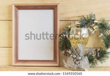 A mock-up of a wooden photo frame. Christmas style