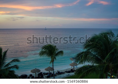 Over looking turquoise water during sunset
