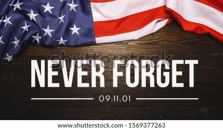 Patriot Day September 11 9/11 USA banner - United States flag or merican flag, 911 memorial and Never Forget lettering background or backdrop Royalty-Free Stock Photo #1569377263