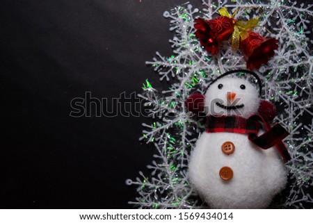 Decorative Christmas and snowman isolated on black background
