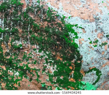 Old painted granite stone rock background. Green, green, brown