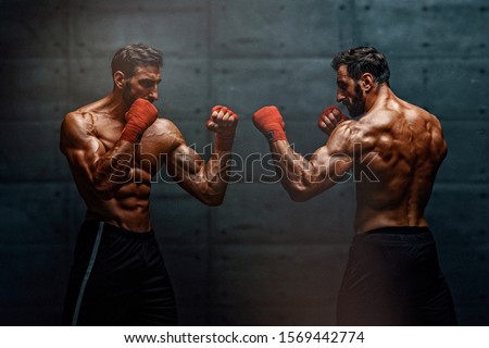 MMA, Kickboxing, Boxing Men Face Off Himself Royalty-Free Stock Photo #1569442774