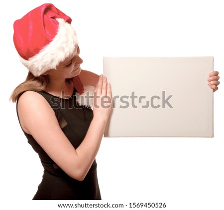 Woman with a Christmas hat showing an empty banner