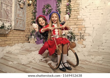 sleigh bells ring. The morning before Xmas. Little girls on sledge. Happy new year. Winter. xmas online shopping. Family holiday. Christmas tree and presents. Child enjoy the holiday.