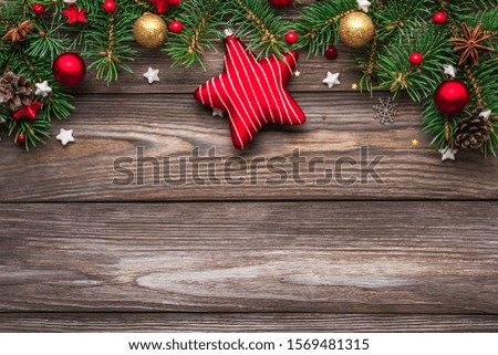 Christmas composition. Fir tree branches, gift boxes, decorations, pine cones on rustic wooden background. Christmas, winter, new year concept. Flat lay. top view with copy space