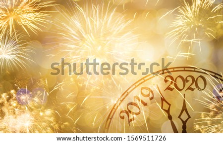 New Year concept, clock near to the midnight of 2020, fireworks golden bokeh background Royalty-Free Stock Photo #1569511726