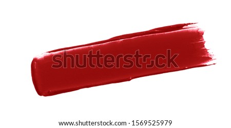 Matte lipstick smear smudge swatch isolated on white background. Cream makeup texture. Red color cosmetic product brush stroke swipe sample