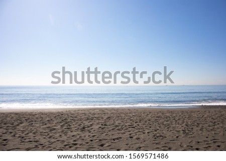 This is a picture of the beach. The weather is nice and pleasant. The place is Kanagawa Prefecture in Japan.