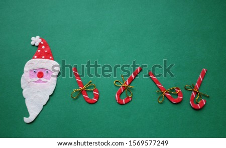 gift box ,candy and Santa Claus on green background decorations for Christmas new year concept