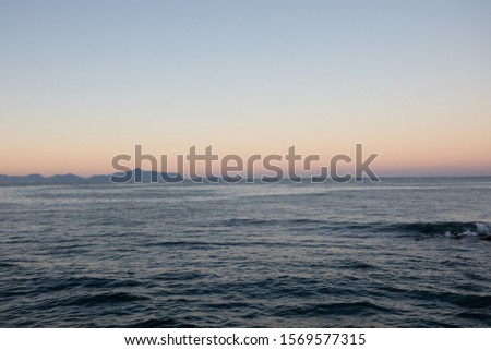 This is a picture of the sunrise taken at the sea. The place is Japan's Kagoshima Prefecture.