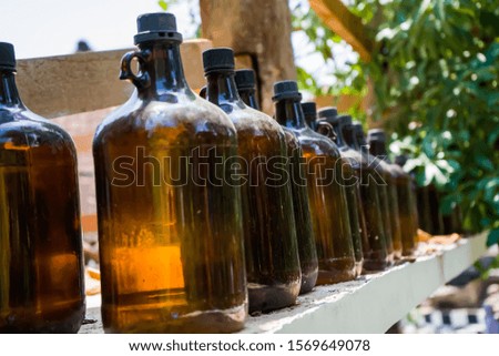 Selective and soft focus image the row of brown colour of empty glass bottles.