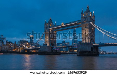 City skyline at sunset with London Tower Bridge and the Shard on Thames river in England