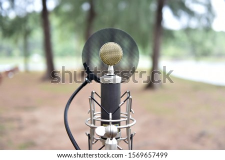 Microphone on stand in the park.