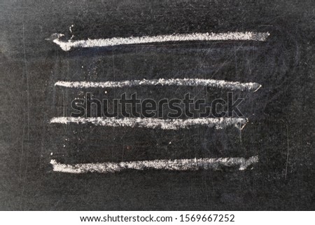 White chalk hand drawing in line shape on black board background
