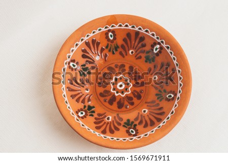 photo of a brown vintage clay plate