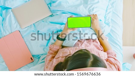top view of asian woman use smartphone to watch video 