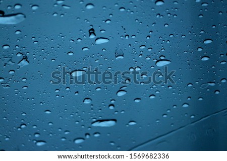 Rainy season on the mirror of car