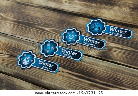 Blue sticker with Christmas illustration on wooden background