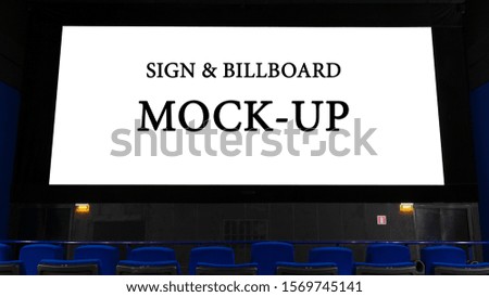 large Billboard in the form of a cinema monitor, convey information through the screen in the cinema hall. large advertising layout. Royalty-Free Stock Photo #1569745141