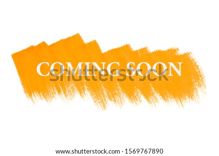 Coming soon on yellow paint background, isolated on white. Advertising banner concept.