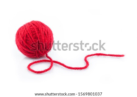 yarn color red on white background. Royalty-Free Stock Photo #1569801037