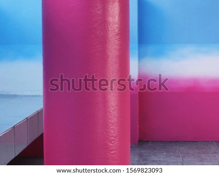 rough monotone cement wall with pink poles Copy space for editing and text  photo of background and texture concept