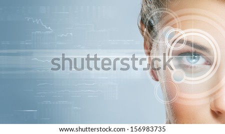Close-up portrait of young and beautiful woman with the virtual hologram on her eyes (laser medicine and security technology concept) Royalty-Free Stock Photo #156983735