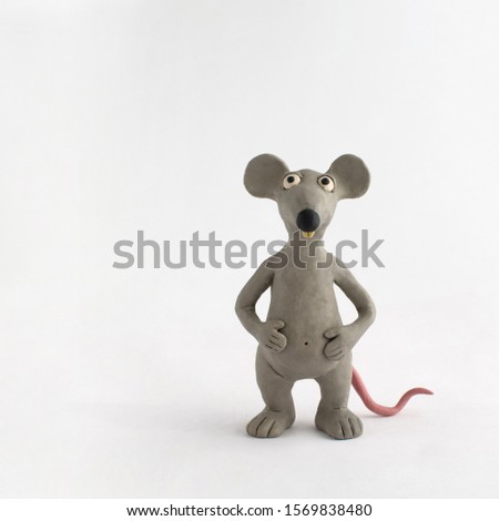 Plasticine gray mouse on a white background