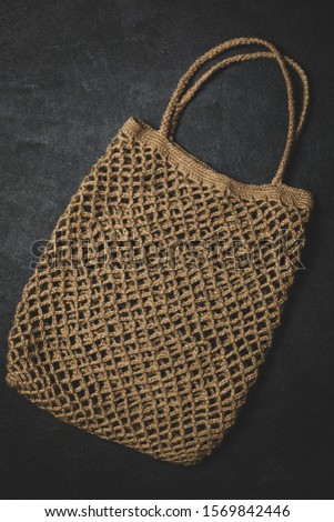 Eco-friendly knit bag for environmentally conscious people. Made from natural hemp thread. The concept of a healthy lifestyle. Biodegradable. Handmade.