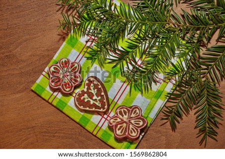 Ginger cookies lie on a wooden background. Christmas sweetness.