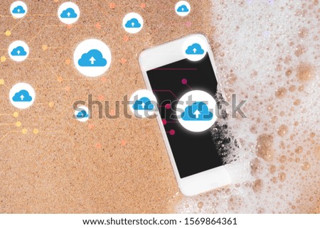 Smart phone on tropical beach with cloud icon abstract background. Technology business concept.