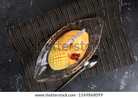 Pineapple with ice cream in glass plate 