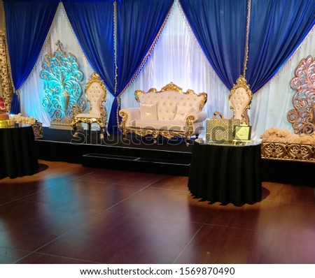 This is a wedding ceremony event with on stage seating for family members. Interior decoration. family events party birthday celebration