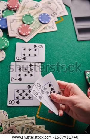 casino background, street cards flash player and dollars and chips on the poker table. Gaming business, success. With space for design. Online casino, online poker. Vertical frame.