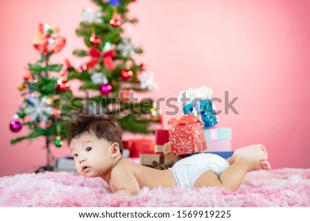 A little baby celebrates Christmas. New Year's holidays.