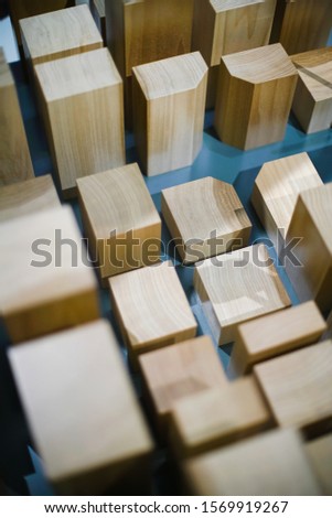    Abstraction. Rectangular wooden objects of different heights. Table game                            