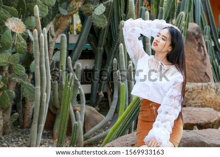 Portrait asian woman wearing white shirt and brown skirt in cact
