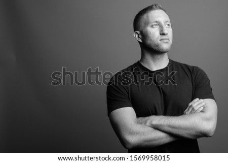 Portrait of muscular man in black and white
