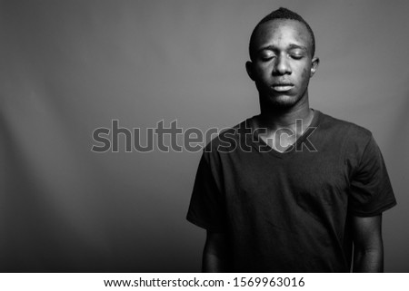 Portrait of young African man in black and white