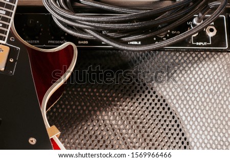 vintage electric guitar and amplifier speaker closeup                               